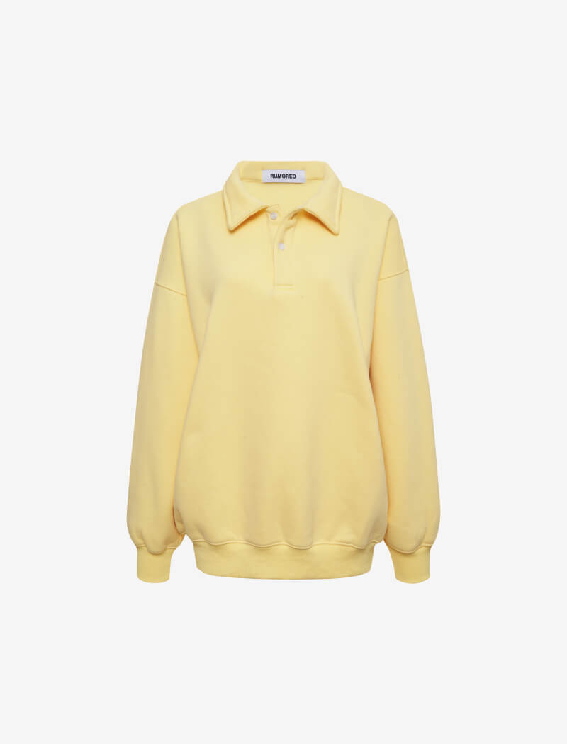 Flat lay Rumored 100% Cotton Airport Sweatshirt in Buttercream