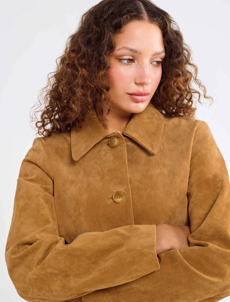 Model wearing genuine suede, vintage-inspired button-up jacket