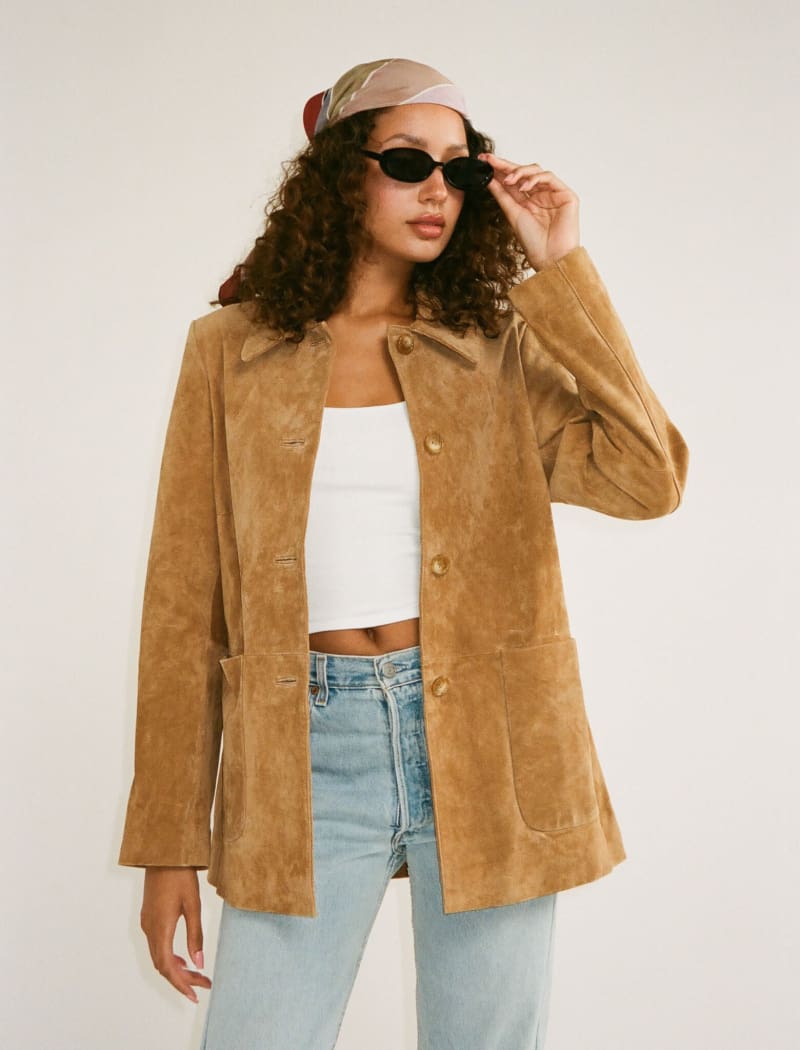 Model wearing genuine suede, vintage-inspired button-up jacket
