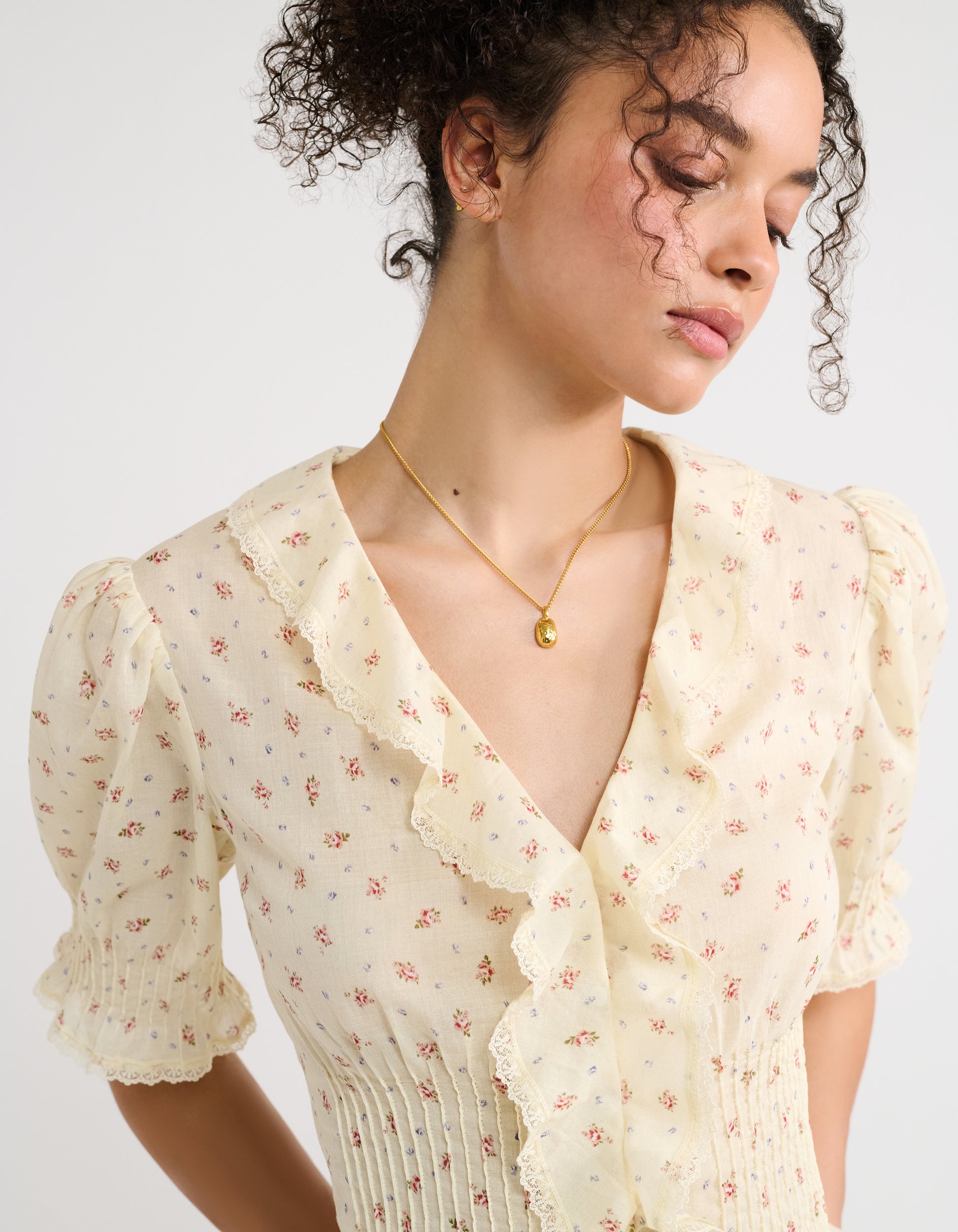  Ruffles, lace trim, a dainty floral print, and hand-sewn micro pintucks 