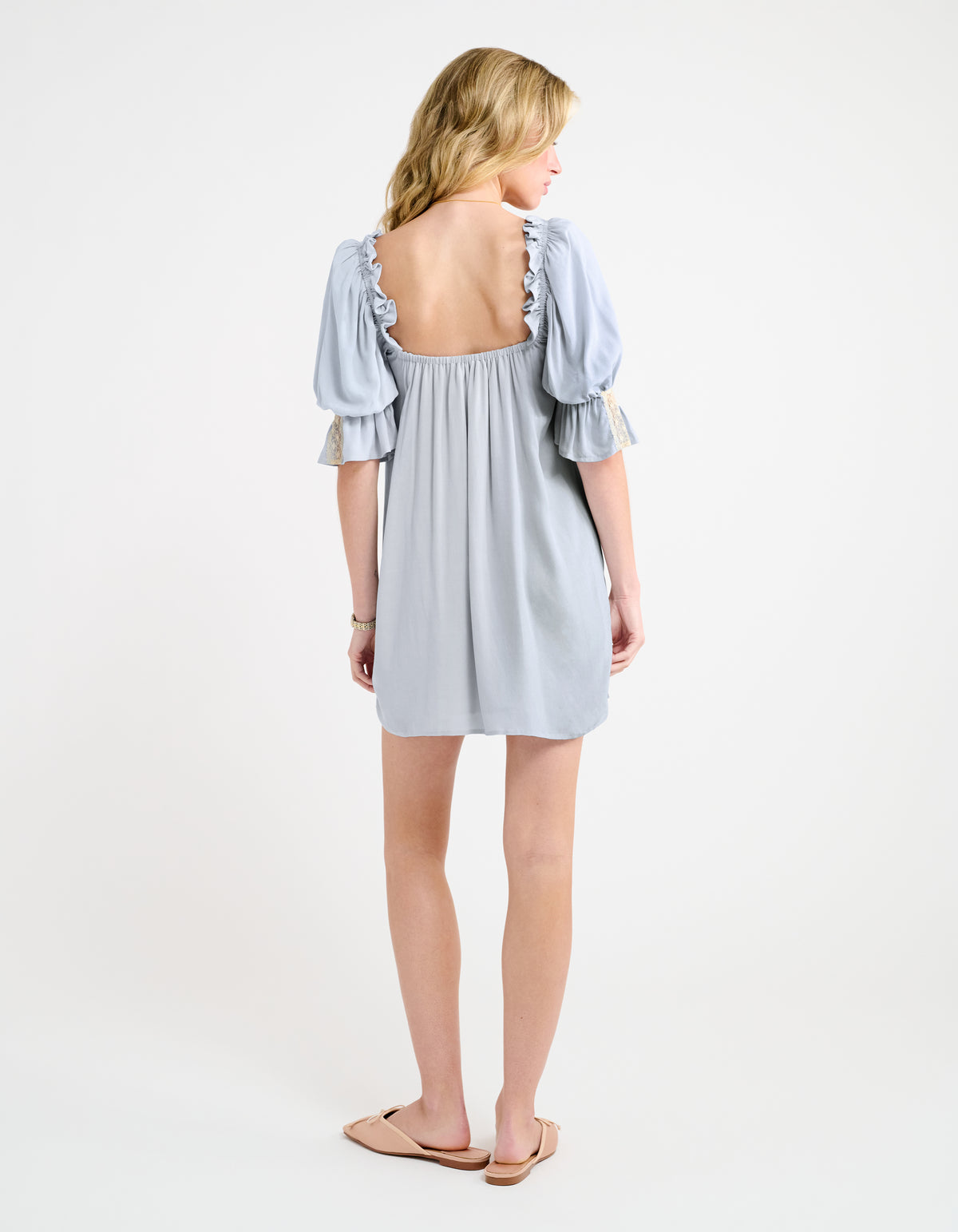 U shaped back with elastic ruffle around shoulders/arms