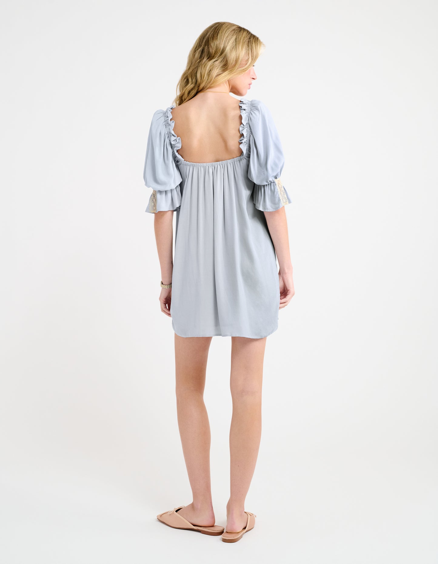 U shaped back with elastic ruffle around shoulders/arms