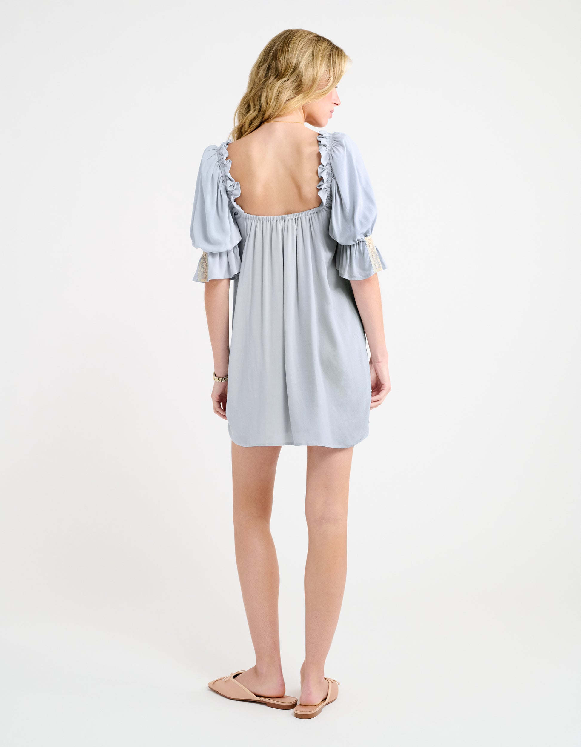 U shaped back with elastic ruffle around shoulders/arms