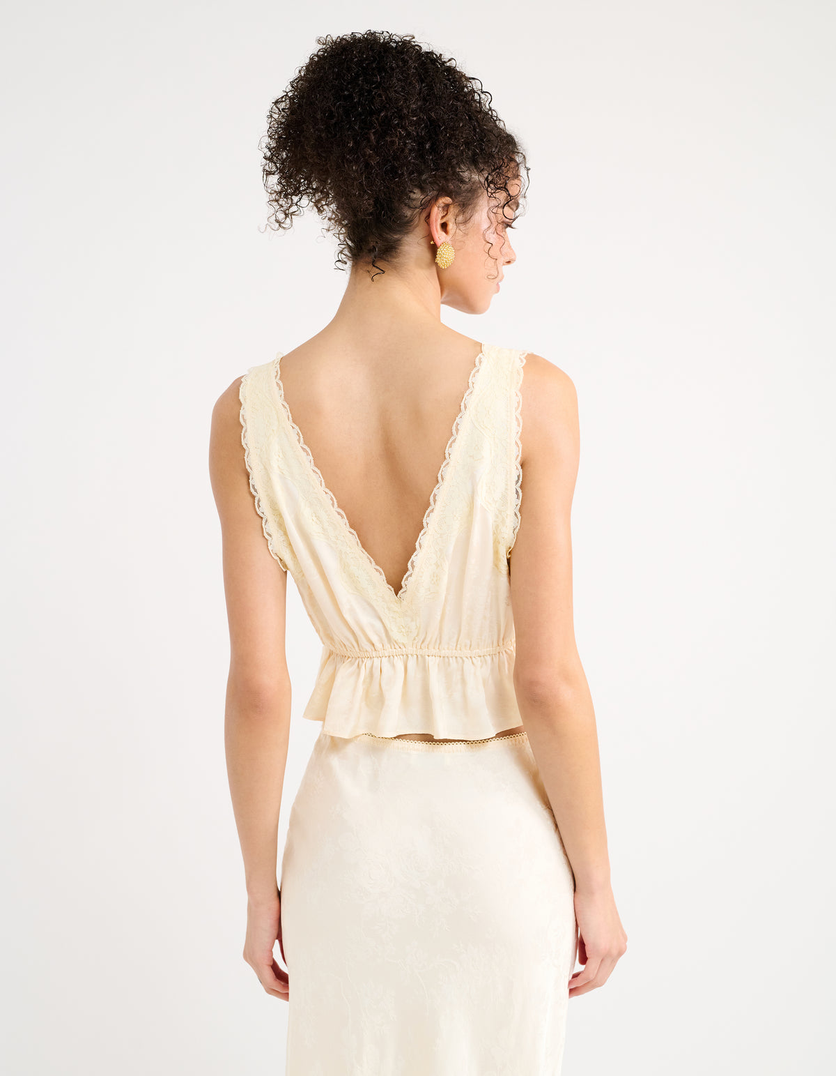 Deep V neck back with peplum waist