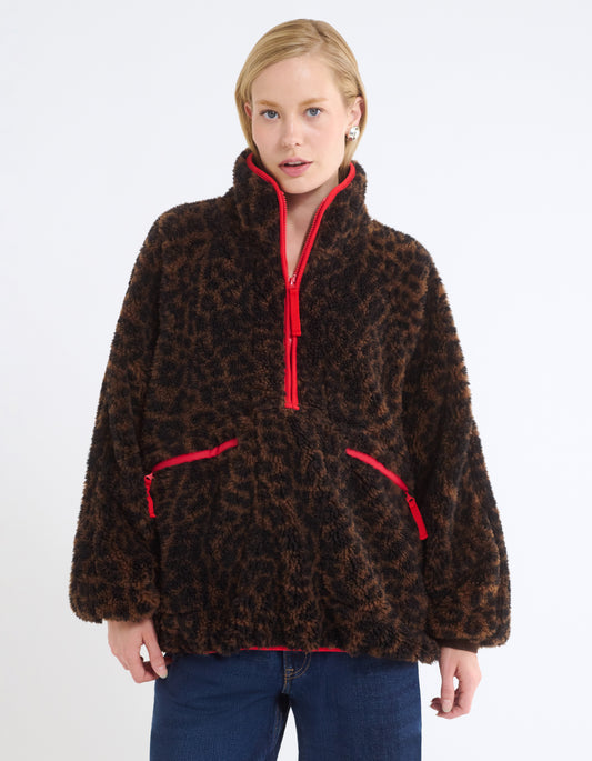 Oversized Fit
Plush Sherpa, jersey bonded
Contrast red nylon accents
Zip front henley with collar
Raglan sleeve
Zipper pockets at waist