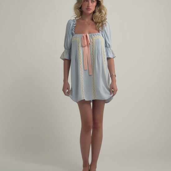 Modeling walking in Heirloom Mini Dress in French Blue