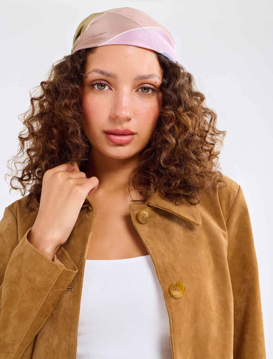 Model wearing genuine suede, vintage-inspired button-up jacket