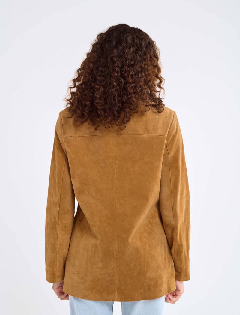 Model wearing genuine suede, vintage-inspired button-up jacket