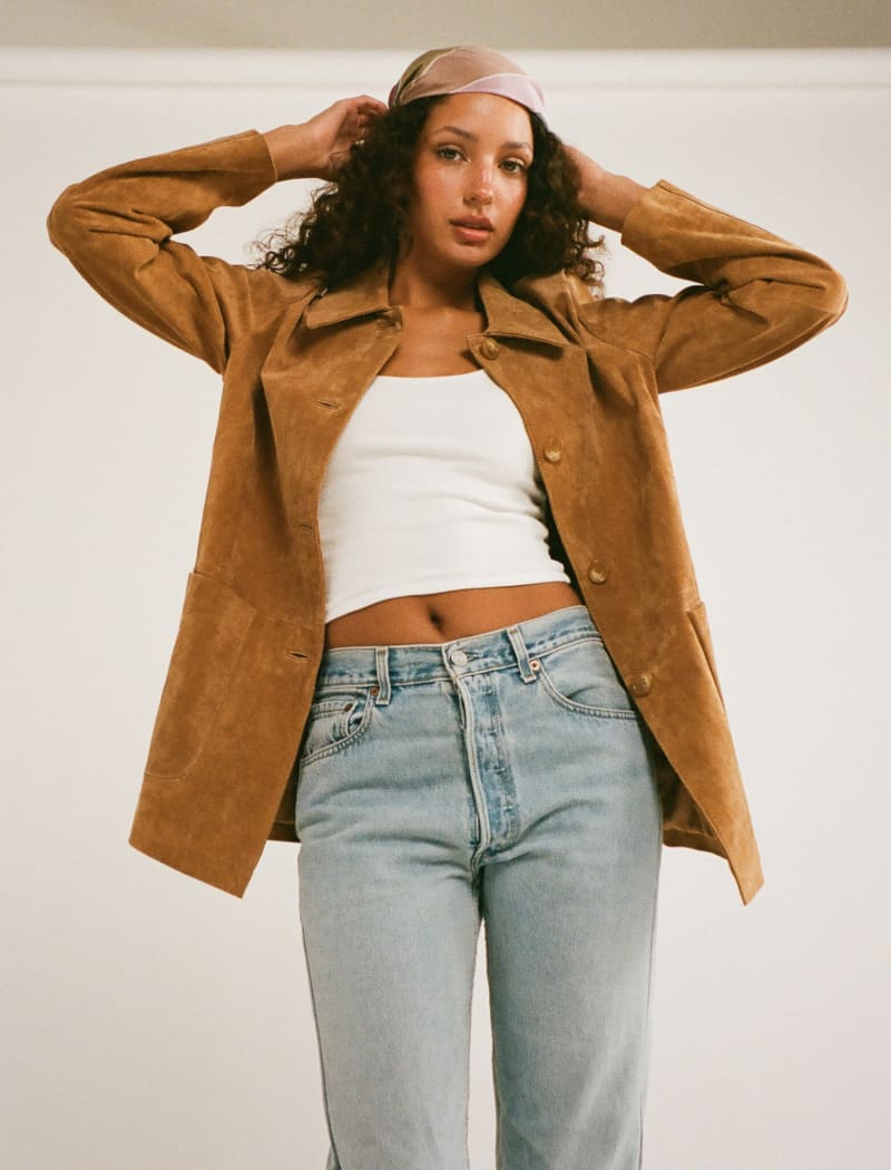 Model wearing genuine suede, vintage-inspired button-up jacket